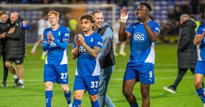Oldham Athletic celebrate their victory at Tranmere Rovers in the FA Cup