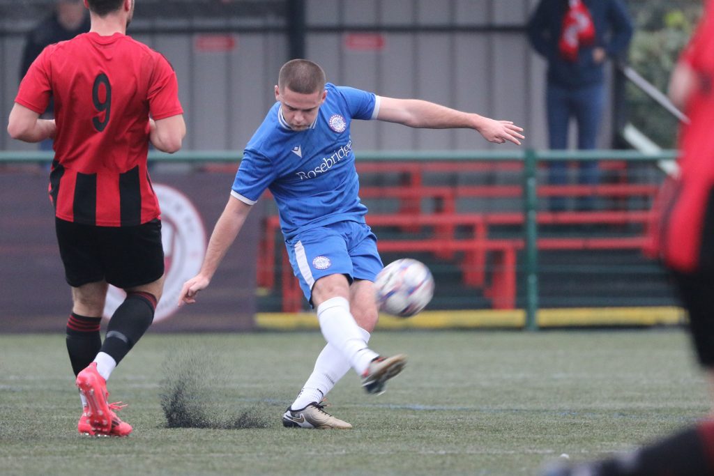 Match action between Lower Breck and Ramsbottom United