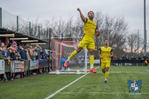 Bury's DJ Pedro celebrates his goals against Stockport Town